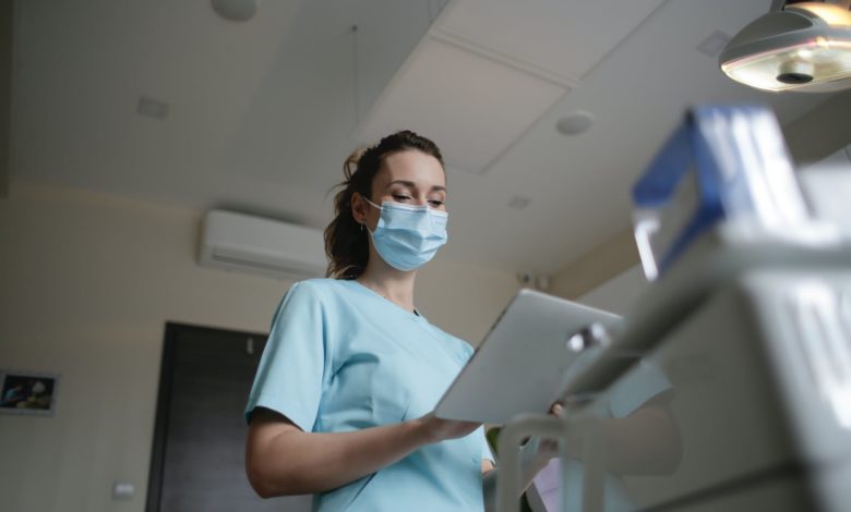 photo of woman wearing a surgical mask