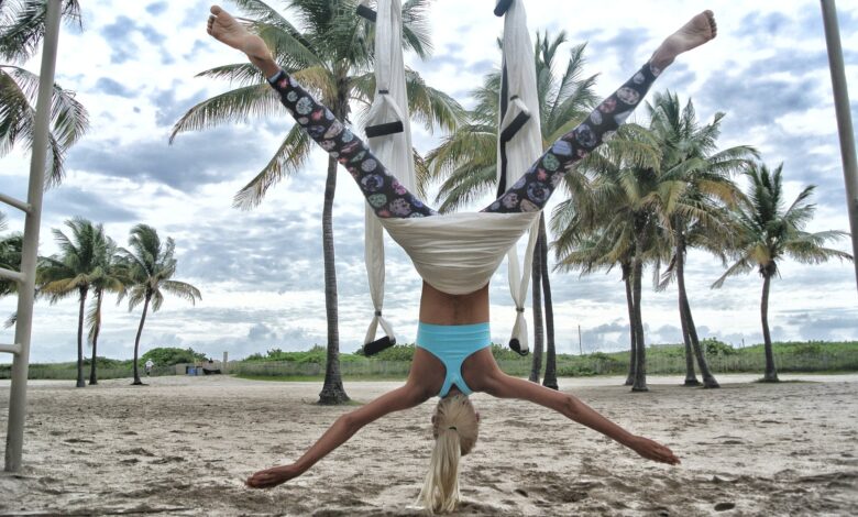 woman doing anti gravity yoga
