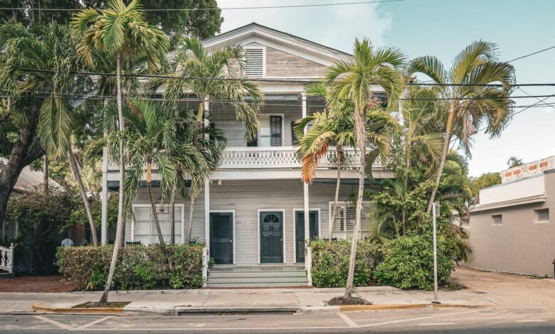 a house with palm trees on the front in key west florida usa