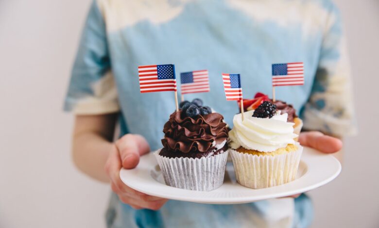 cupcakes with flags of usa on plate