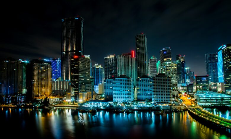 lighted building near body of water at nighttime